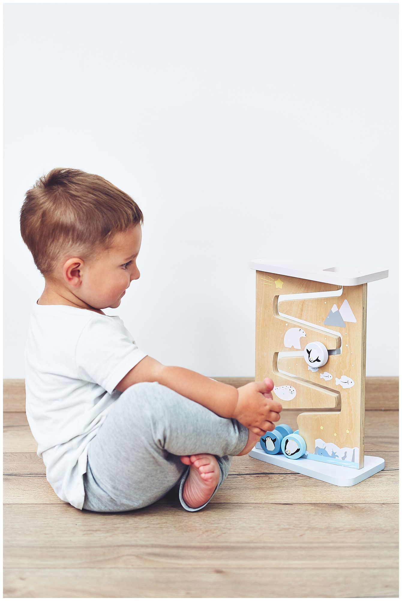 Tavola di legno per la manipolazione sensoriale su due lati