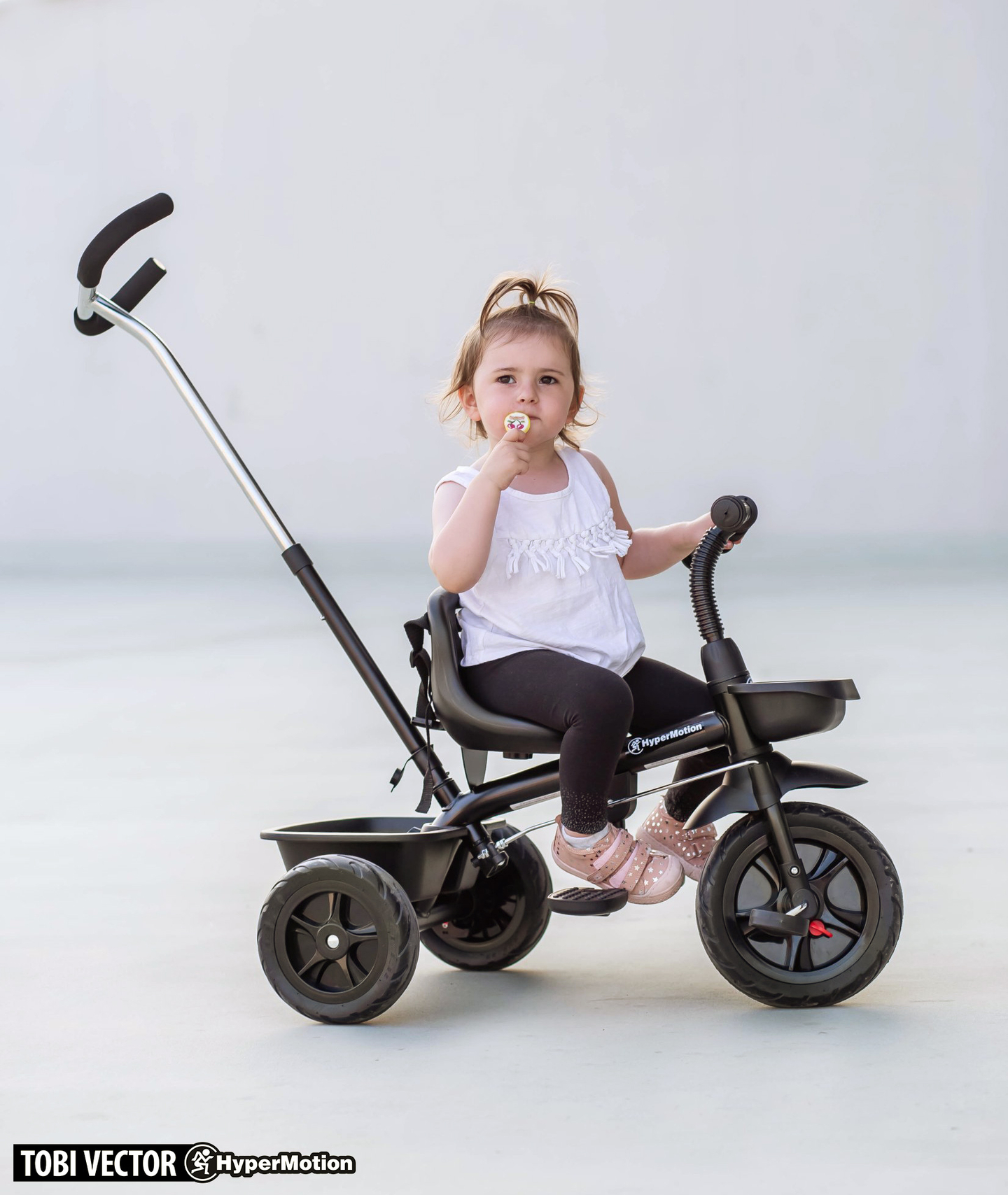HyperMotion TOBI VECTOR triciclo - ruote gonfiabili eterne + barra di spinta. Colore: nero.
